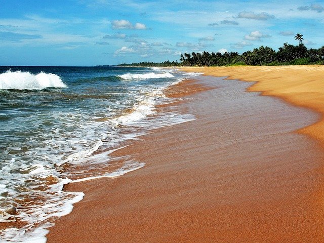 white sand and blue waters