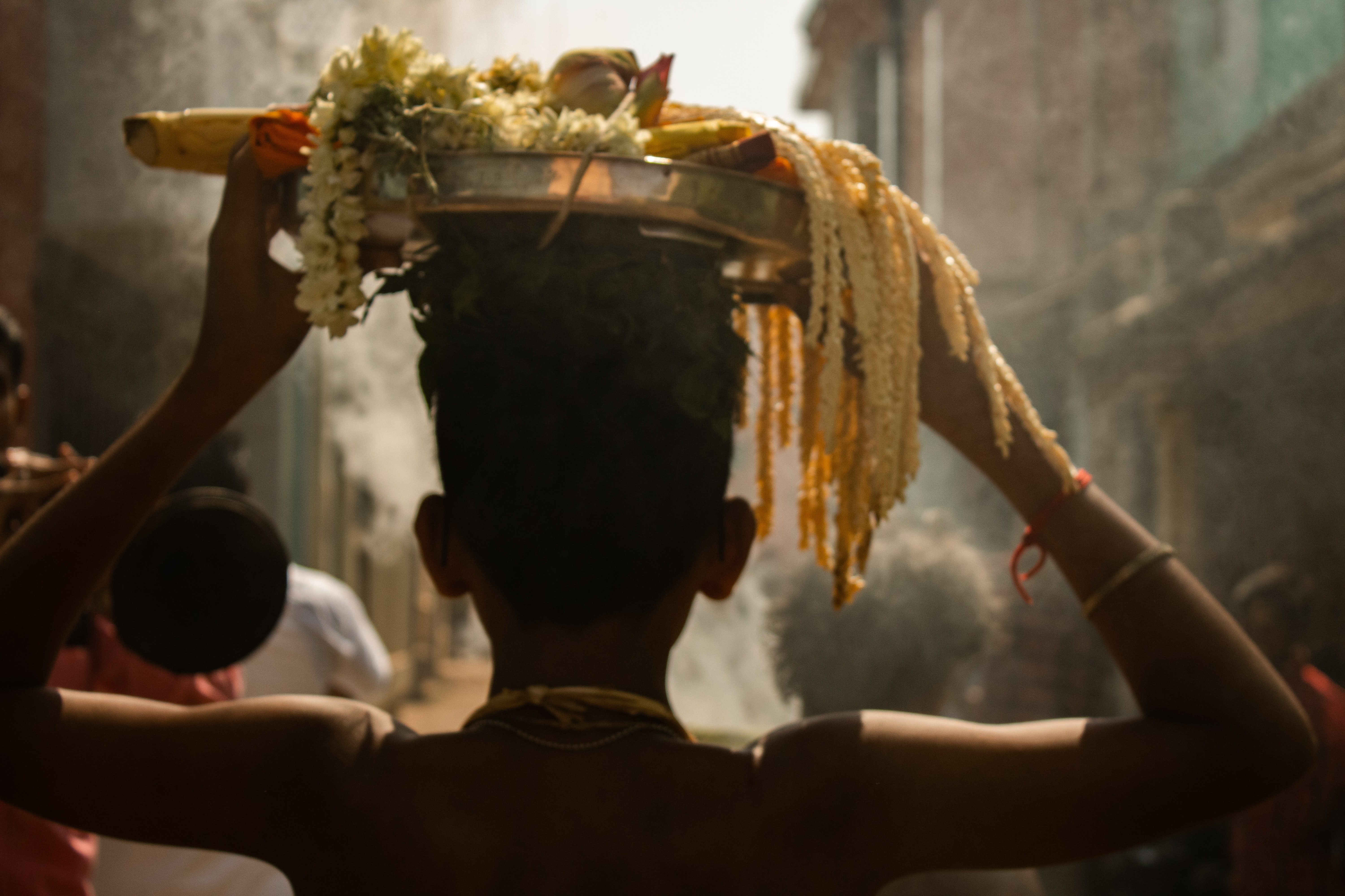 Boy carrying flowers outside Tanjore Temple, things to do in Tanjore